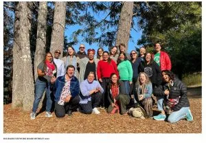 Image of Solidaire Board Retreat 2022, Smiling group in front of redwood trees